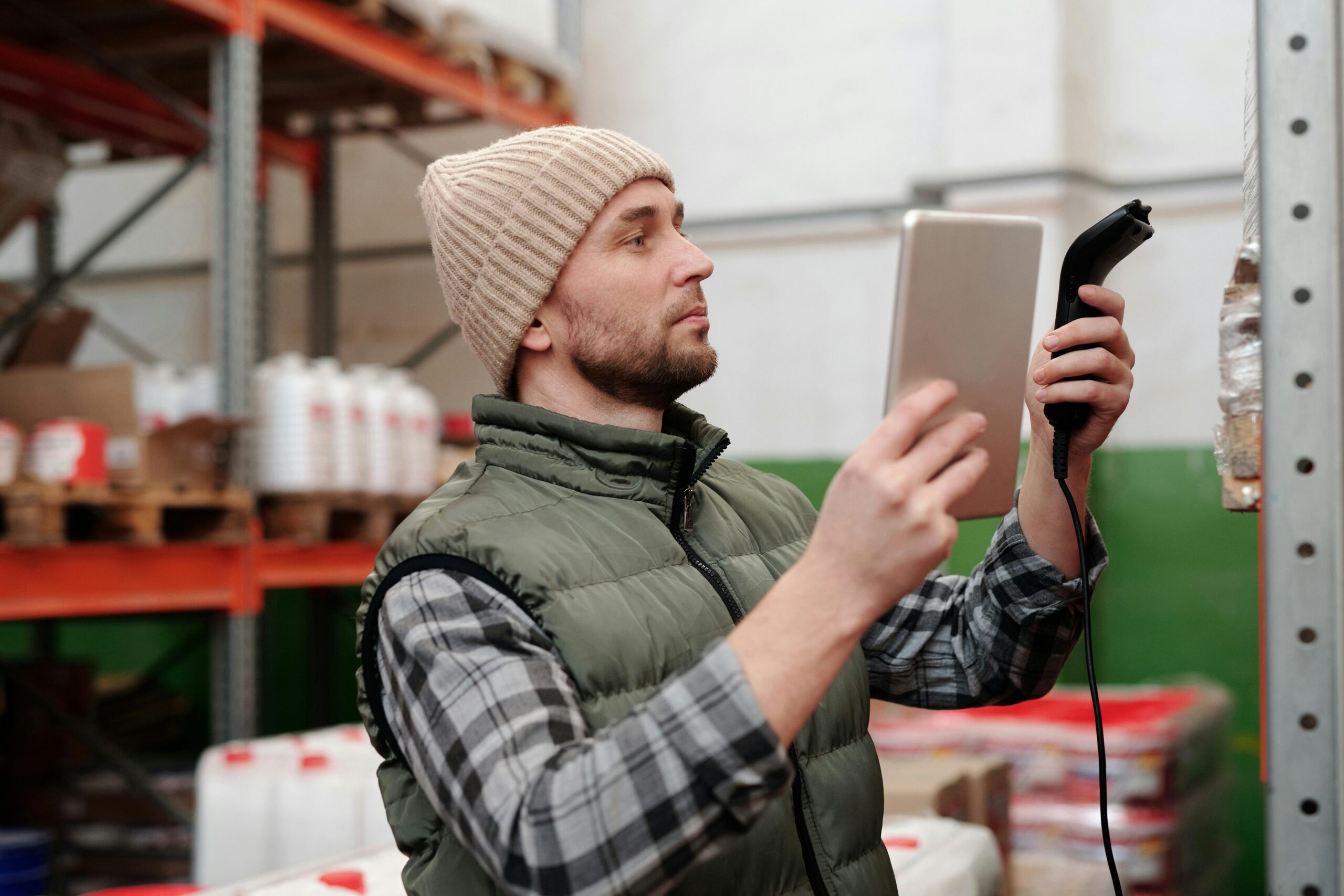 A man checking the inventory using a device