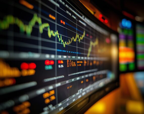 Close-up of a digital stock market display with colorful graphs and data, capturing the dynamic nature of financial trading.